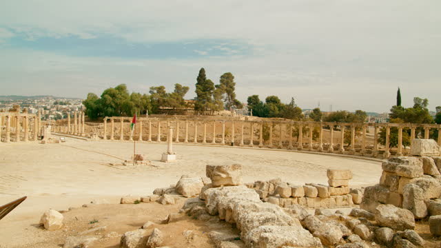 Panoramic view of Oval Plaza with ruins of columns in Jerash, Gerasa, Jordan.