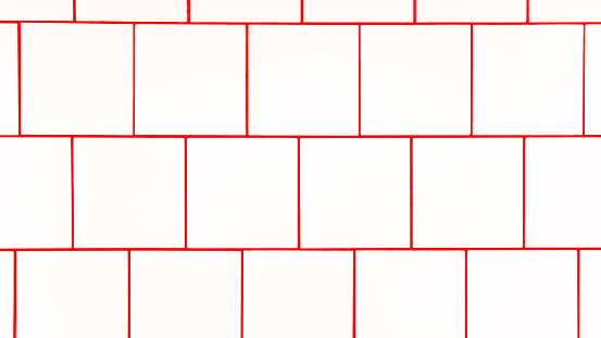 White square ceramic tile with red seam, located horizontally. Abstract background, ceramic tiles texture.