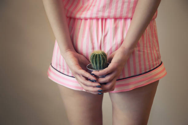 istock a girl in pajamas holds a cactus near the priests. Hemorrhoids, stool problems, bowel problems. postpartum hemorrhoids 1461107826
