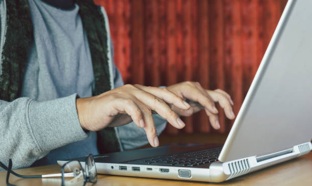istock Hands of young man or women typing on keyboard message, browsing information, searching info during work over new business project on table. 1461111261
