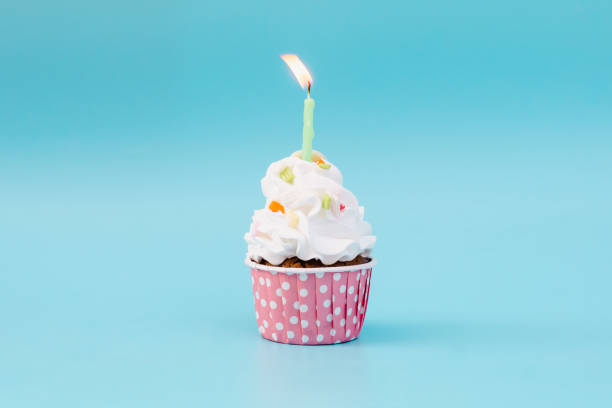 istock Tasty cup cake on blue background with copy space 1461111516