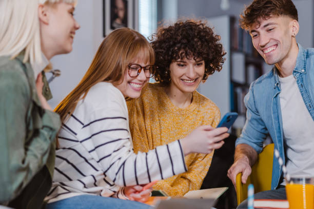 istock Group of young people using smart phone 1461116599