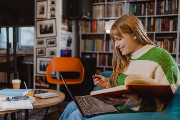 istock Female University student using laptop in the library 1461119140