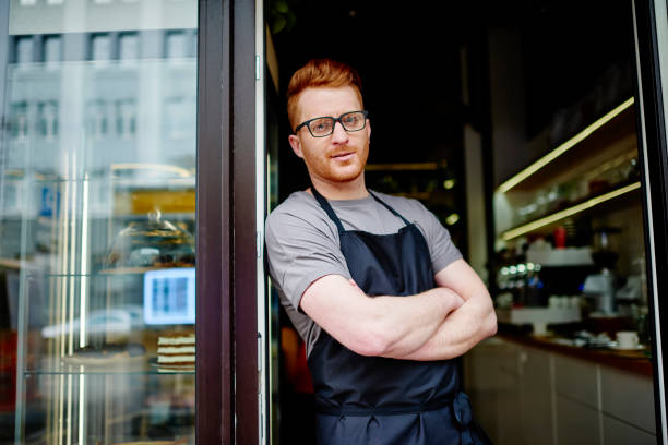 istock Mail business owner in apron at cafe 1461119750