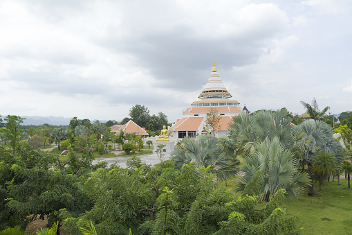 Panorama of Hall of Biography of Somdet Phra Patriarch Chao Krom Luang Wachirayan Sangvara in Kanchanaburi (หอพระประวัติสมเด็จพระสังฆราชเจ้า กรมหลวงวชิรญาณสังวร) seated at River Kwai with building and hall in pagoda style