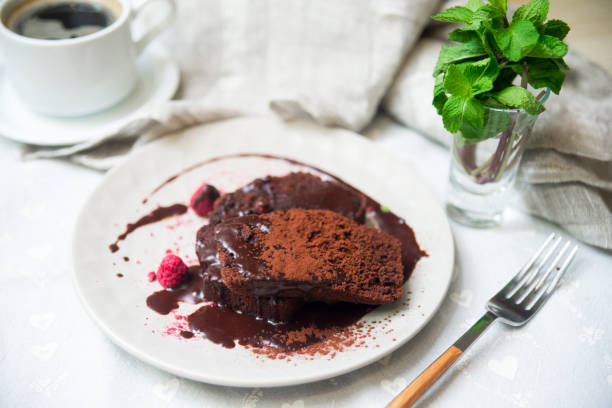 istock A portion of chocolate biscuit, under chocolate ganache and sprinkled with chocolate cocoa powder 1461120375