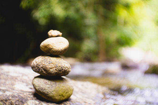 istock Stacking rocks on the lake or river in nature. 1461125073