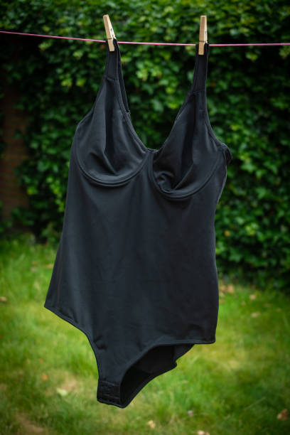 istock Black bodysuit drying outside on clothesline 1461125135