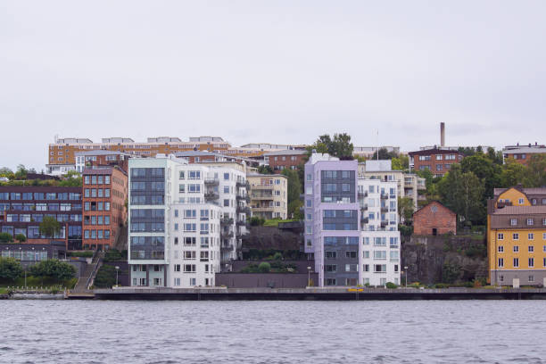 istock View of buildings next to river against clear sky 1461126820