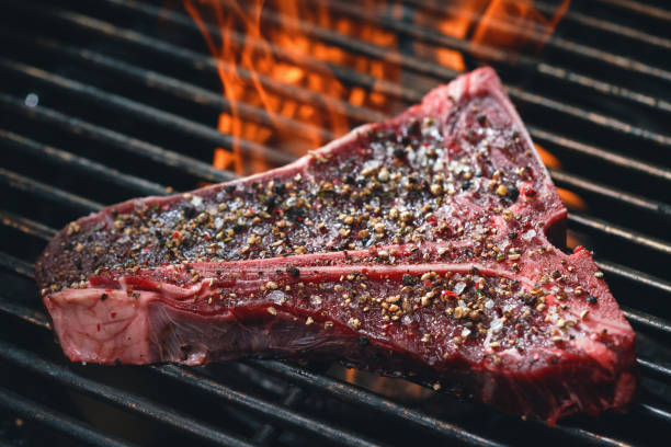 istock Roasting High Quality T-Bone Steak on BBQ Grill 1461126890