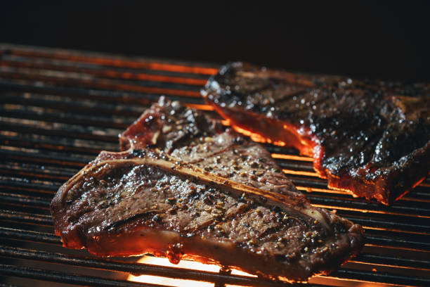 istock Roasting High Quality T-Bone Steak on BBQ Grill 1461126912