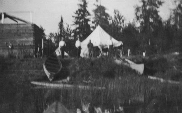 Survey Expedition Camp on Amisk Lake in Saskatchewan, Canada  - 1919 Survey expedition camp on Amisk Lake in Saskatchewan, Canada. Vintage photograph ca. 1919. 1910 1919 photos stock pictures, royalty-free photos & images