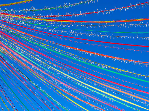 istock Festive background. Multicolored ribbons and garlands in the sky. 1461136949