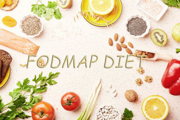 istock FODMAP diet with text in center. Mediterranean healthy low ingredients - vegetables, greenery, fruits, nuts, beans, egg, flax seeds, chia seeds. Flat lay 1461137484
