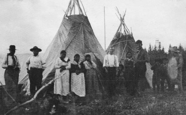 Group of Cree Families at Pelican Narrows in Saskatchewan, Canada  - 1919 stock photo