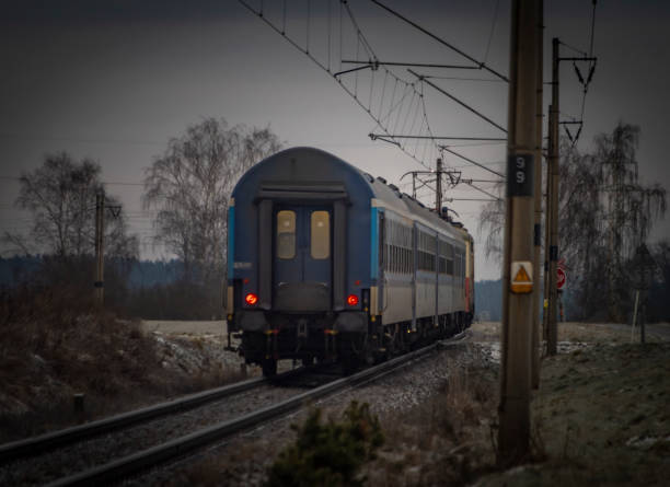 Passenger electric train in frosty cloudy morning near station Donov 01 30 2023 stock photo