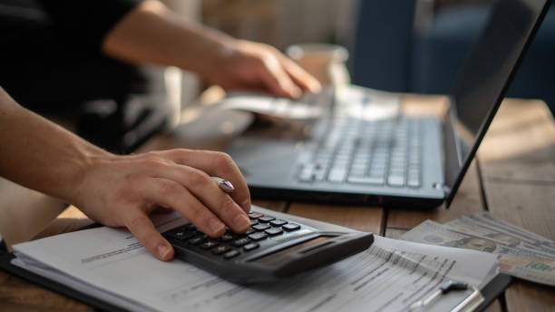 istock Close-up Man is calculating house bills cost 1461139226