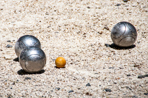 Metal balls for Petanque game on a playground.
