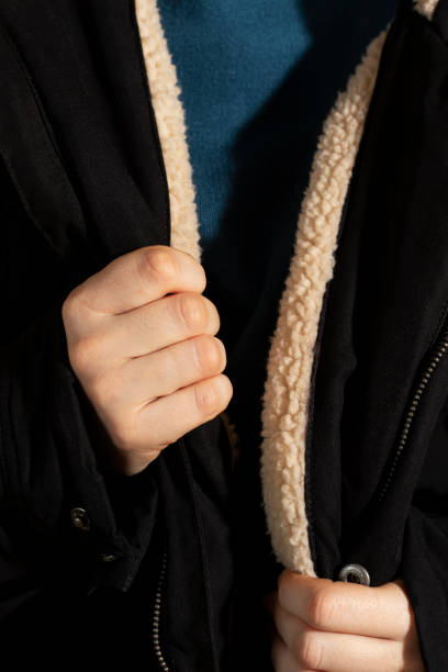 istock Unrecognizable person in black jacket. 1461140854