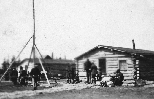 The Wekusko train station at mile 81 of the HBR Line on the day the train arrives in Manitoba, Canada. Vintage photograph ca. 1924. The train at the time only came through once a week.