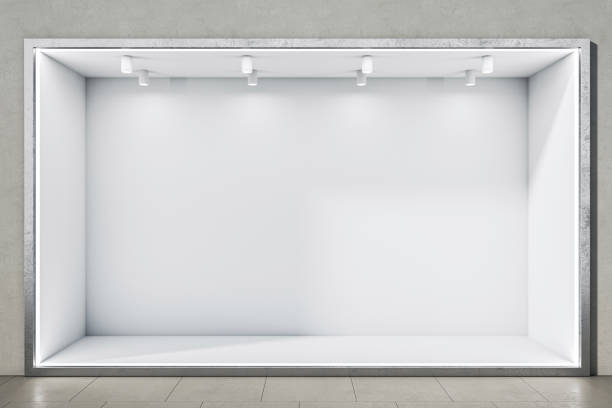 Front view on blank white niche with place for car or product presentation and glowing lamps on top in grey wall background and glossy floor. 3D rendering, mockup stock photo