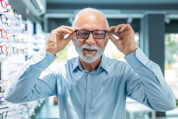 istock Senior man buying eyeglasses looking at camera 1461145669
