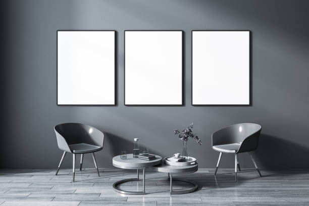 istock Front view on three blank white posters in black frame on dark wall background in grey shades living room with coffee table among glossy chairs on wooden floor. 3D rendering, mockup 1461146717