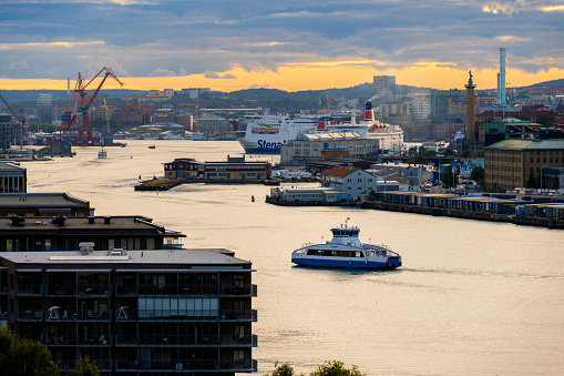 Gothenburg, Sweden - August 31 2022: Passenger ferries crossing the river at Stenpiren.