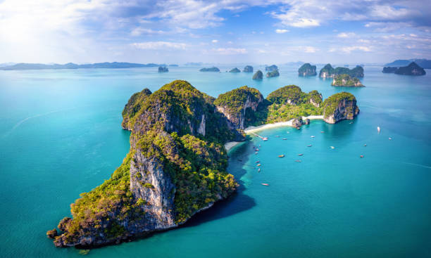 Aerial view of the beautiful Hong island in Thailand Aerial view of the beautiful Hong island in Thailand with lush greenhills and golden beaches surrounded by emerald sea phang nga bay stock pictures, royalty-free photos & images