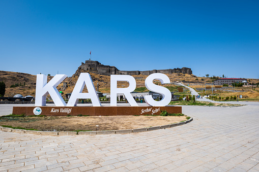 Kars, Turkey - August 2022: Kars Castle and monument for tourists in the center of Kars, Turkey.