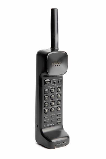 A vintage cordless telephone from the 90s isolated on a white background.