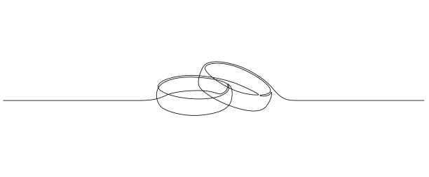 One continuous line drawing of Wedding rings. Romantic elegance concept and symbol proposal engagement and love marriage in simple linear style. Editable stroke. Outline vector illustration One continuous line drawing of Wedding rings. Romantic elegance concept and symbol proposal engagement and love marriage in simple linear style. Editable stroke. Outline vector illustration. marriage proposals drawing stock illustrations