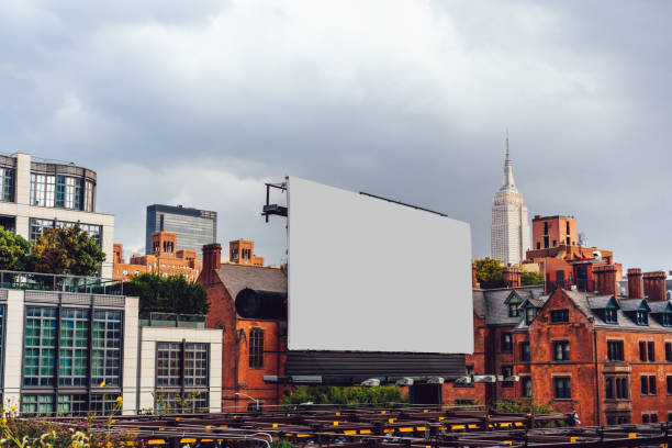 istock Publicity mock up billboard on exterior of modern building in urban area. Template for paste advertising or commercial information, blank billboard with copy space on facade in city 1461158849
