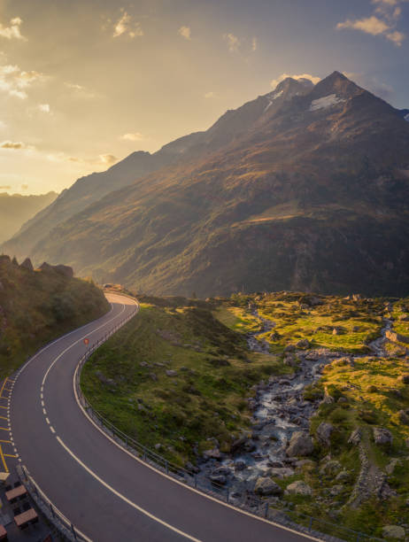 istock A pass road in the mountains towards sunset 1461166656