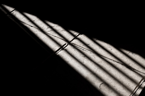 Sunlight reflection on tiled floor. Reflection of sunlight through a window onto the tiled floor