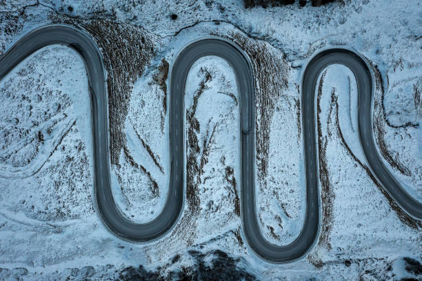 istock A snake shaped pass road in winter photographed from above 1461168087