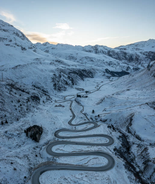 istock A snake shaped pass road in winter photographed from above 1461168419