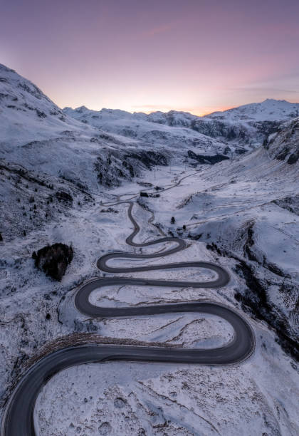 istock A snake shaped pass road in winter photographed from above 1461168491