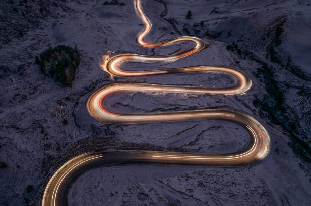 istock A snake shaped pass road photographed at night.light painting 1461168553