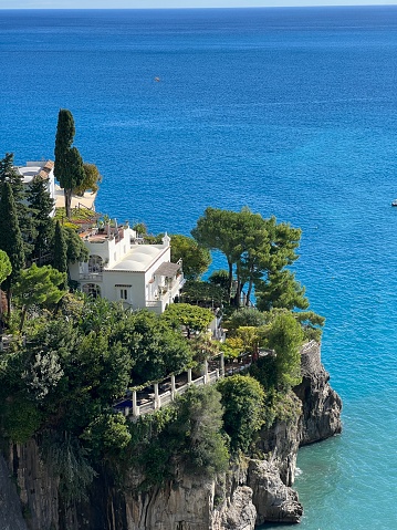 Beautiful mansion on a cliff on Amalfi coast line of Mediterranean sea, Italy.