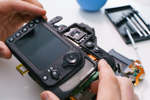 istock Broken Digital SLR photo camera repair 1461172223
