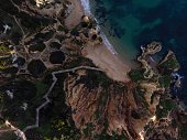 Aerial top down panorama of wooden walkway stairs staircase stairway at Praia do Camilo beach in Lagos Algarve Portugal