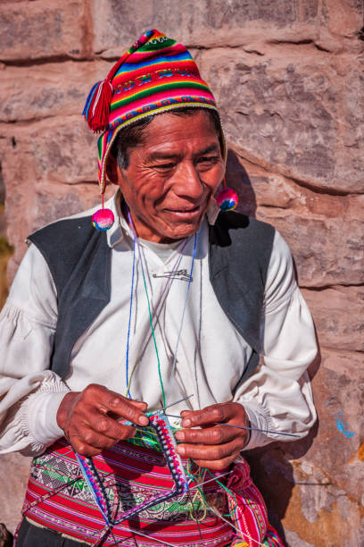 istock Man knitting a hat on Taquile Island, Lake Titicaca, Peru 1461178739
