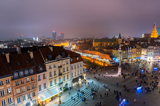 View of the Warsaw Poland Old Town Square During Holiday Weekend with Cloudy Night Skies
