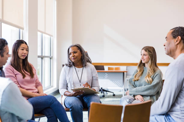 istock Diverse group meets in community center for free counseling 1461189356