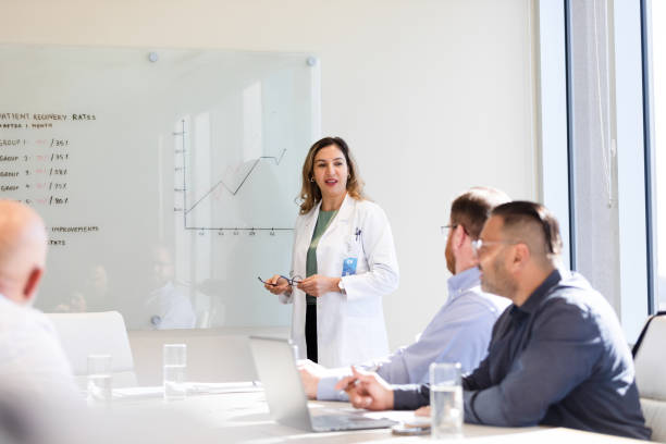 istock Female anesthesiologist talks to the group 1461189889