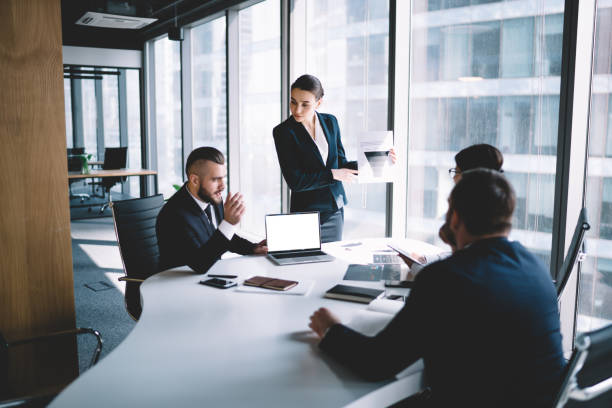 istock Concentrated colleagues having meeting in office 1461198324