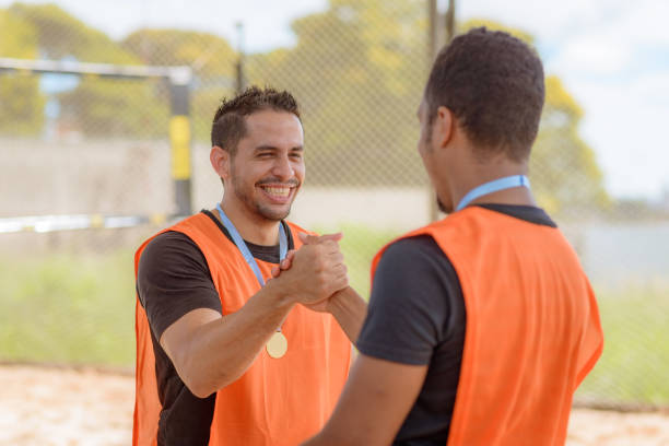 istock Volleyball player receiving victory medal 1461207765