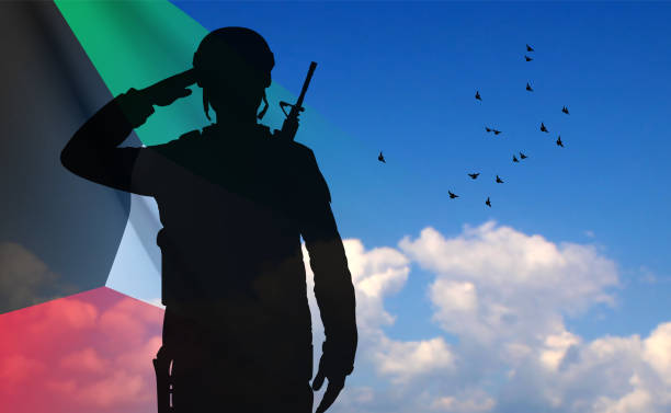 istock Kuwait flag with silhouette of a saluting soldier 1461216466