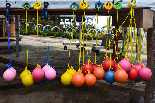 Lato-lato is a type of traditional game that can be found in Indonesia. These lato-lato have been very iconic since the 1990s, especially for people who live in rural areas